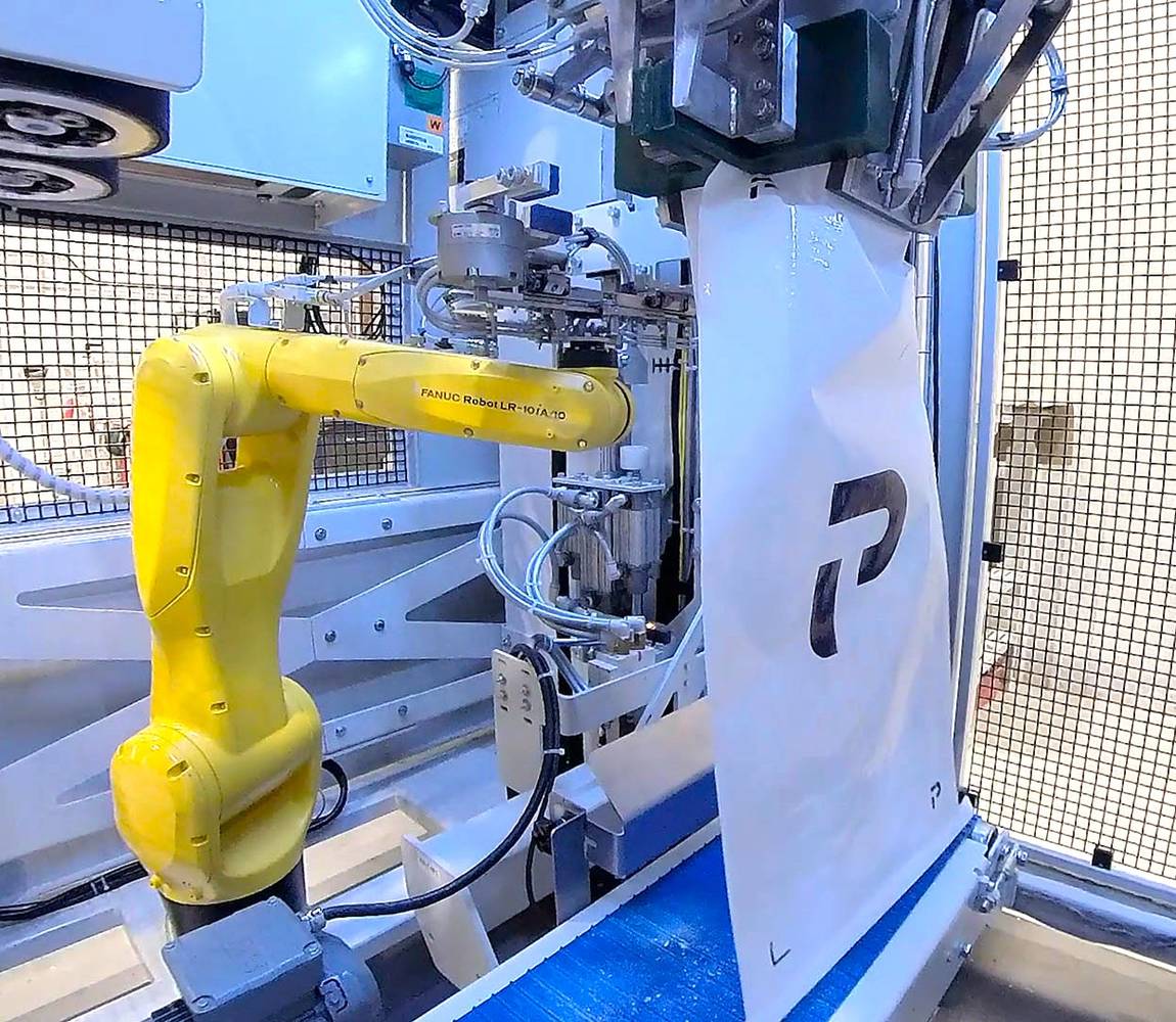 Robot inside the CHRONOS OMR bagging machine