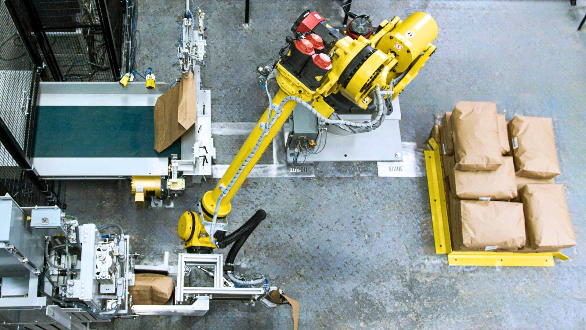 Robotic valve bag placer and palletizer