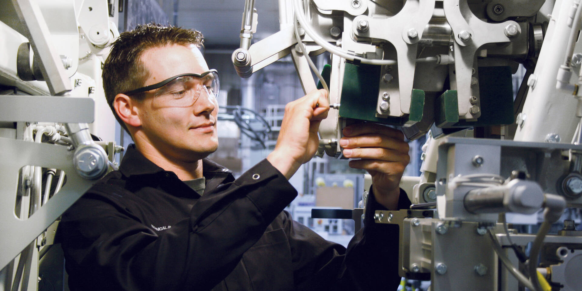 Premier Tech technician performing maintenance on an equipment