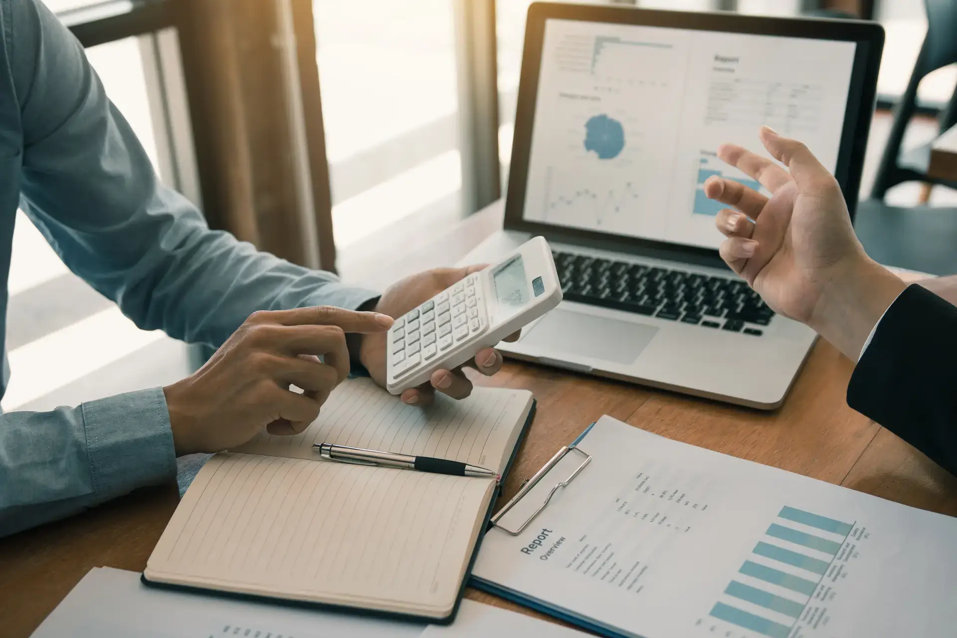 People calculating financial results and costs