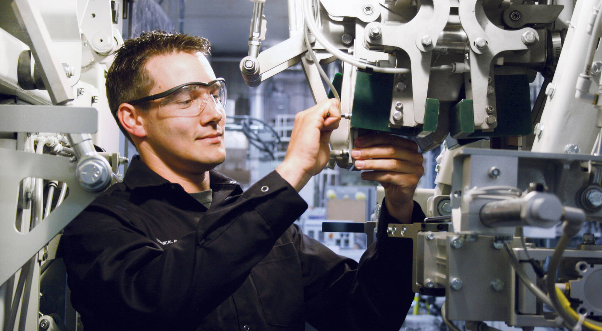 Premier Tech technician performing maintenance on an equipment