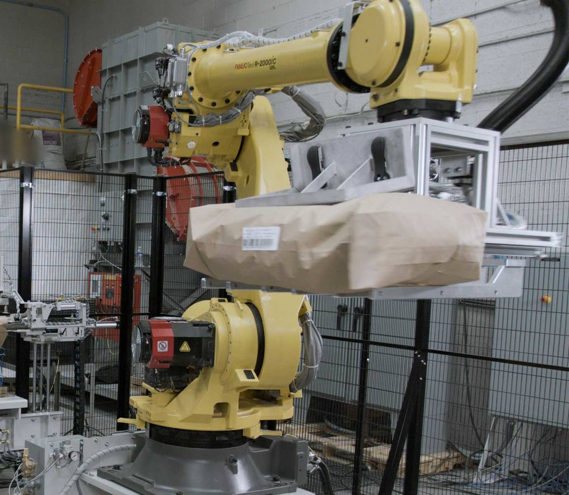 Robotic valve bag applicator - palletizer