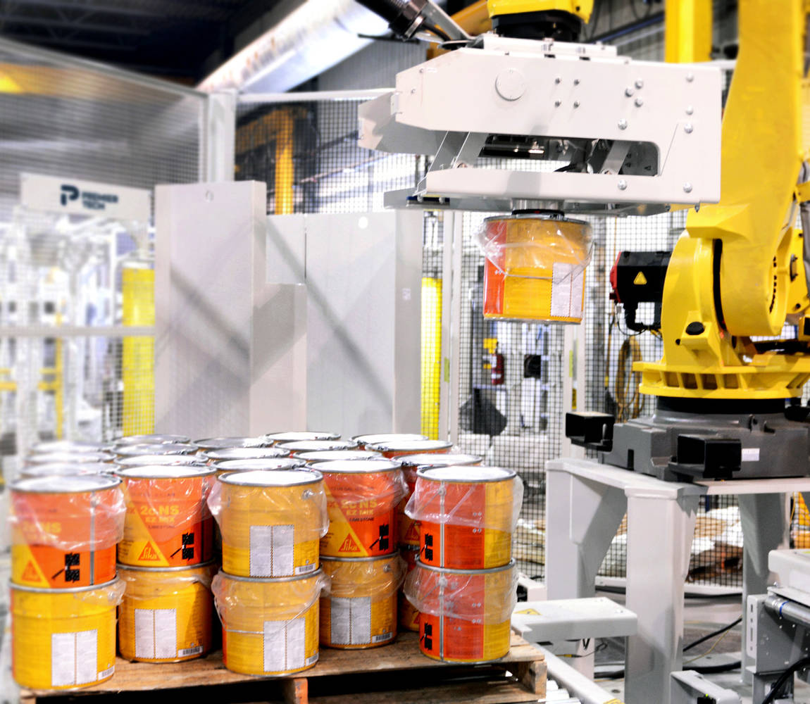 Robotic palletizer stacking a paint bucket on a pallet
