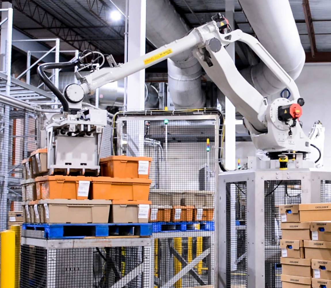 Sanitary robotic palletizer picking up bins