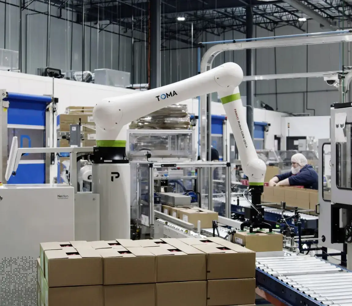 TOMA palletizer operating on production floor