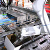 High-speed robotic case packer in out inside view