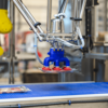 CPD series case packer picking product with vacuum cup end effector