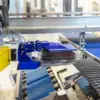 CPD series case packer placing product into a box