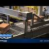 Conventional case palletizer - boxes on conveyor