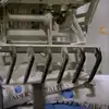 Robotic palletizer gripper picking up a bag