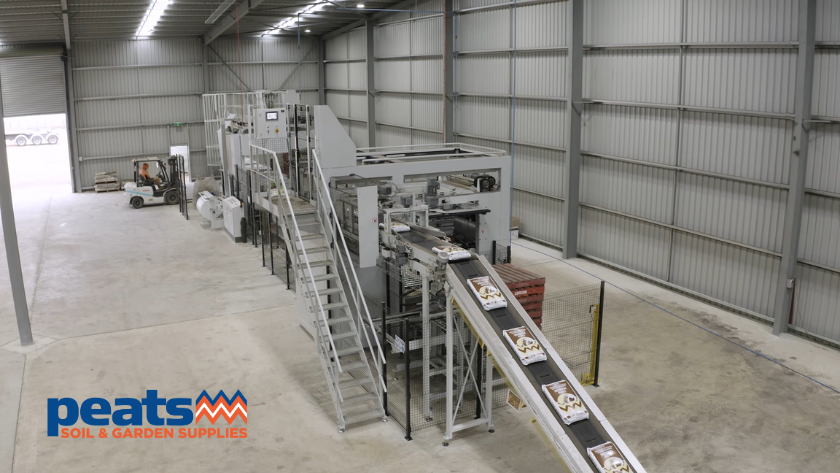 Premier Tech automated soil packaging line in action for bagging, palletizing, and hooding bags of garden soil